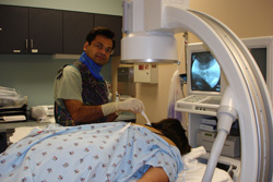 Dr. Bhakta performing a fluoroscopy-guided procedure